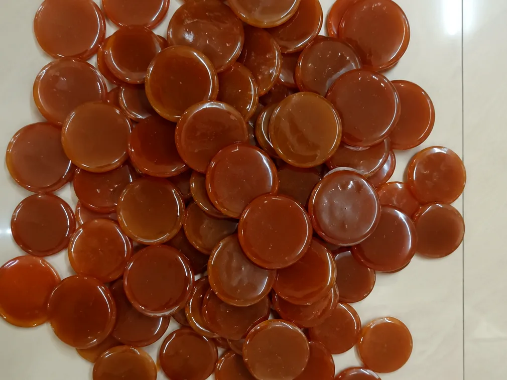 Our button lac — handmade amber shellac discs, actual product photo