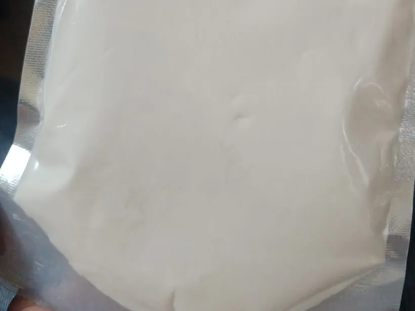 Spray-dried gum arabic powder, Acacia senegal, in a sample pouch