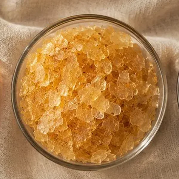 Blonde shellac flakes in a glass bowl, lighter natural wax grade